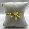 #PAL138 - Pulsera Ajustable Moño De Bolitas Oro Laminado 18K