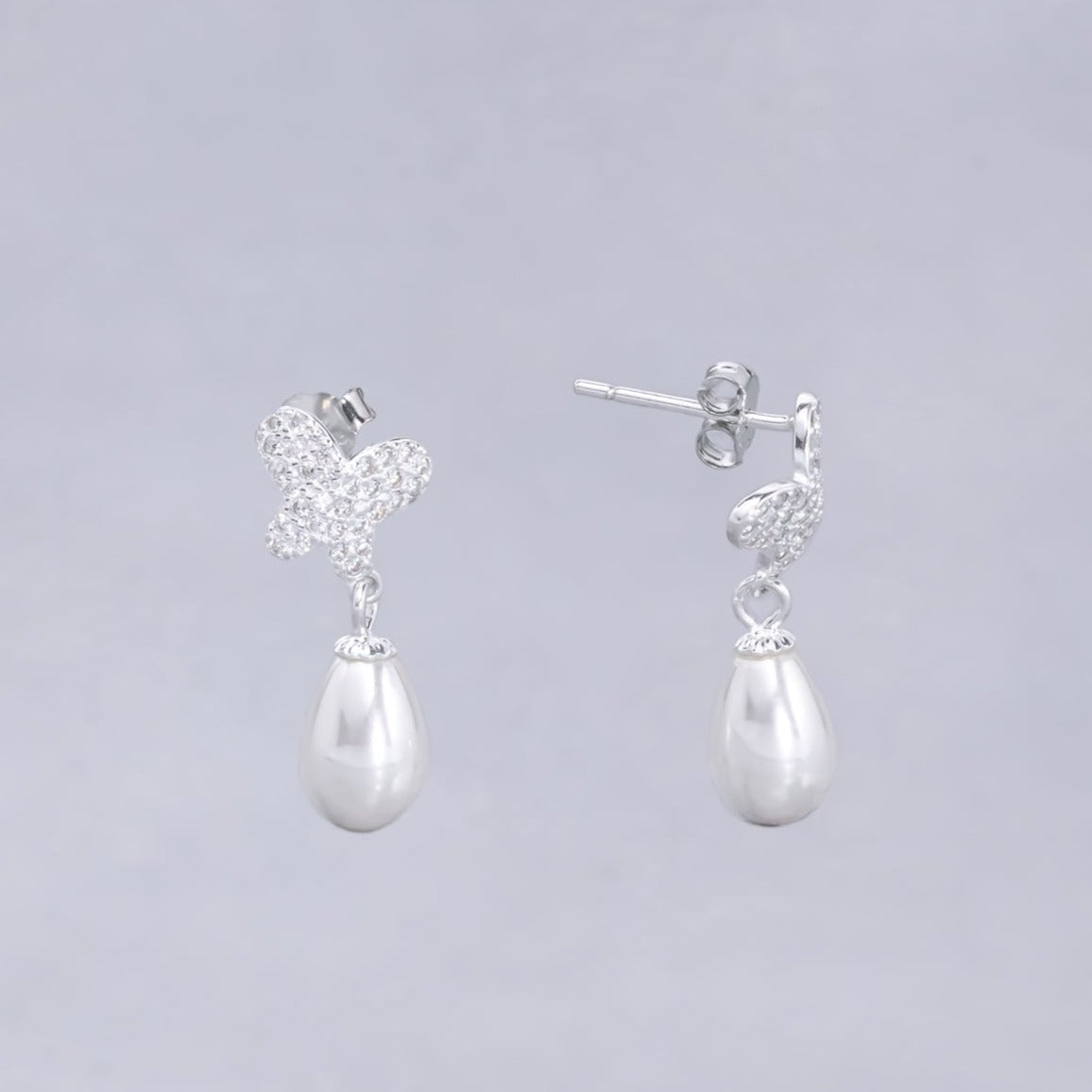 #AR159 - Arete De Mariposa Con Perla - PU1.9